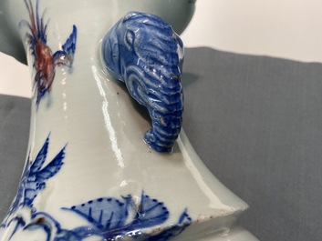 A Chinese blue, white and copper red vase with elephant handles, 19th C.